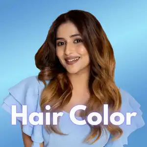 Portrait of a woman with professionally styled hair color featuring soft brown balayage tones and voluminous waves, showcasing a salon hair coloring service by Awesome Hair & Beauty Salon