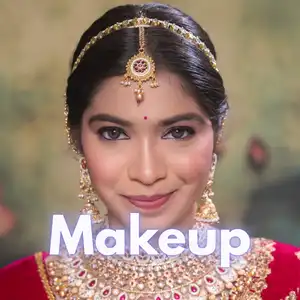 Close-up bridal makeup portrait of an Indian bride wearing traditional red outfit and bridal jewellery with soft glam eye makeup, flawless base, and radiant skin finish created by Awesome Hair & Beauty Salon